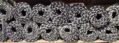 panoramic image of many Rolls of industry Dimple Drainage Board. dimple board. External sealing of the basement wall. Dimpled sheet. foundation protection. sealing outer wall