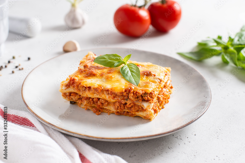 Homemade delicious Meat lasagna with basil leaf on the top. Close up. Recipe, menu. Italian cuisine Homemade delicious Meat lasagna with basil leaf on the top. Close up. Recipe, menu. Italian cuisine
