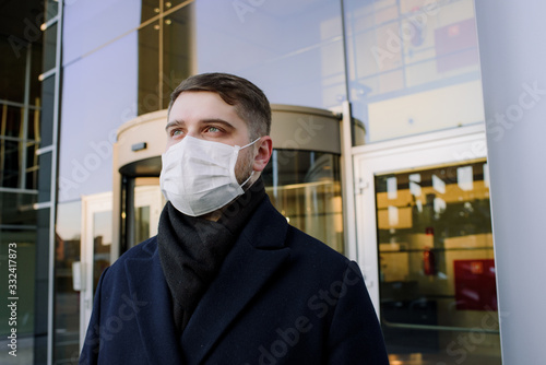 Caucasian young man with face mask to protect from coronavirus covid-19 covid 19 virus global pandemic