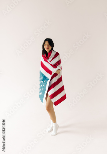 young woman with us flag on the white background