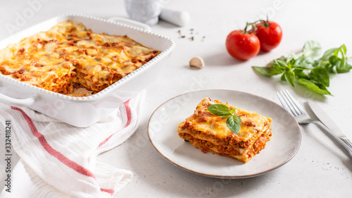 Traditional italian lasagna with vegetables, minced meat, cheese bolognese and bechamel sauce. Side view, menu, recipe