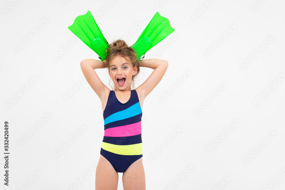 girl in a swimsuit with flippers for swimming underwater on a white background girl in a swimsuit with flippers for swimming underwater on a white background