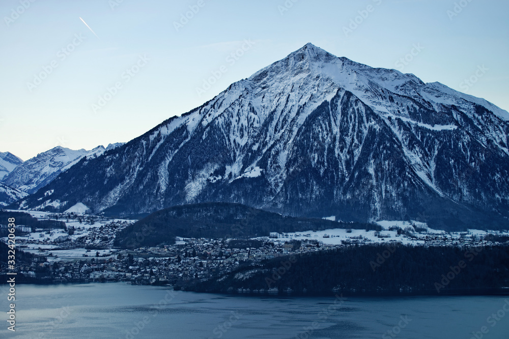 Niesen Swiss Alpine peak and lake view near Thun lake in winter