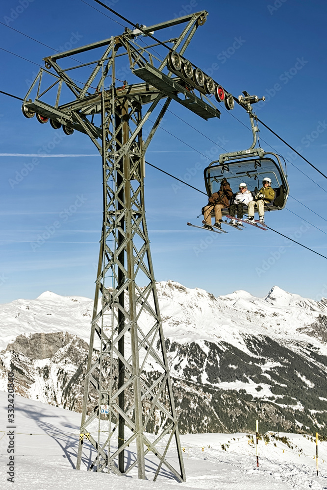 Family on ski in the cable car