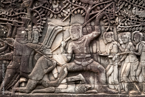 War scene on 12th century relief of Bayon temple, Cambodia. Historical artwork on wall of Khmer landmark in Angkor. UNESCO world heritage site