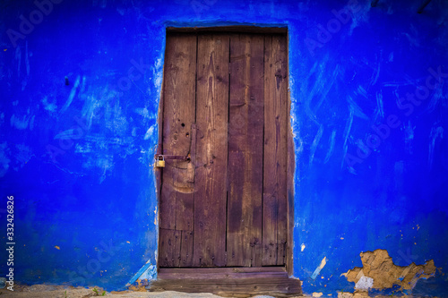 Beautiful windows or doors in a variety of colors and forms with walls textures and old details.