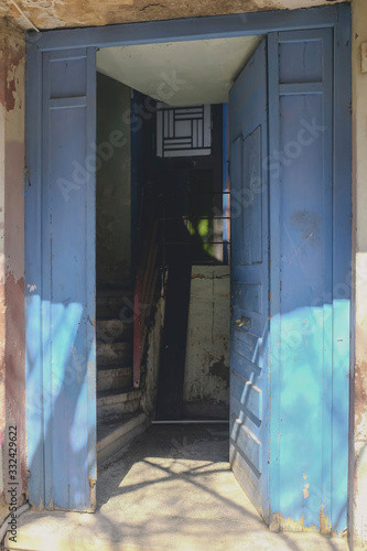 Entrance of old refugee housing in Athens, Greece © Viviana