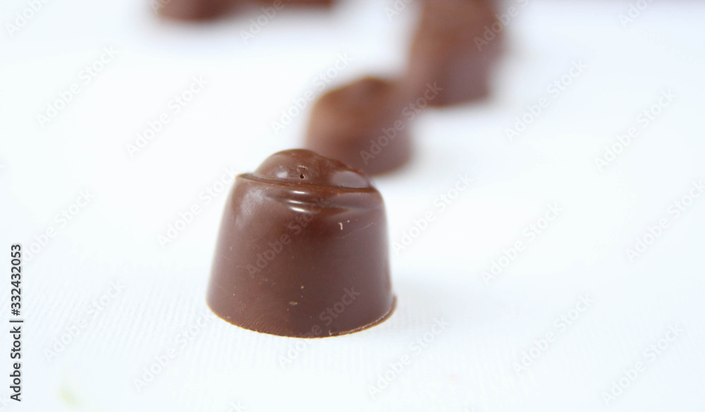 Assortment of delicious chocolate candies isolated on white background. Assortment of delicious chocolate candies isolated on white background.