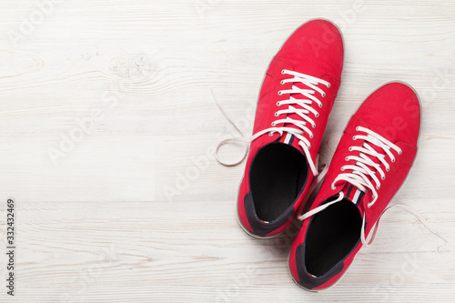 Pair of red sneakers © karandaev