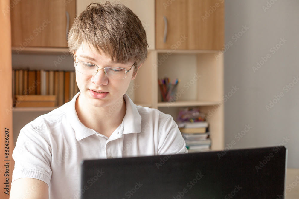 Student learning at home using laptop. Home school, online education, home education, quarantine concept Student learning at home using laptop. Home school, online education, home education, quarantine concept