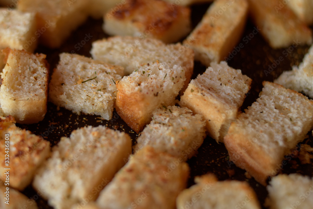 Rusks in the pan. Homemade toasted bread, croutons. Bread in salt, pepper, seasoning, crunchy salad. Rusks in the pan. Homemade toasted bread, croutons. Bread in salt, pepper, seasoning, crunchy salad.