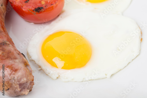 Fragment of english breakfast with the egg.