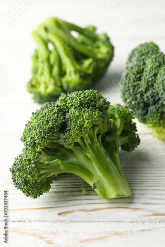 Broccoli on wooden background, close up. Healthy food