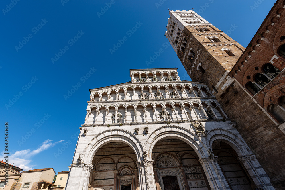 Lucca, facade and bell tower of the Cathedral of San Martino (Saint Martin), in Romanesque Gothic style, XI century. Tuscany, Italy, Europe