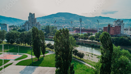 city photographed from air by drone. Old balkan buildings and communism type of architecture. Zenica - Bosnia and Herzegovina. Balkan city with nature around.