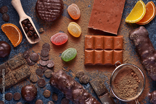 Chocolate and marmalade candys on blue background