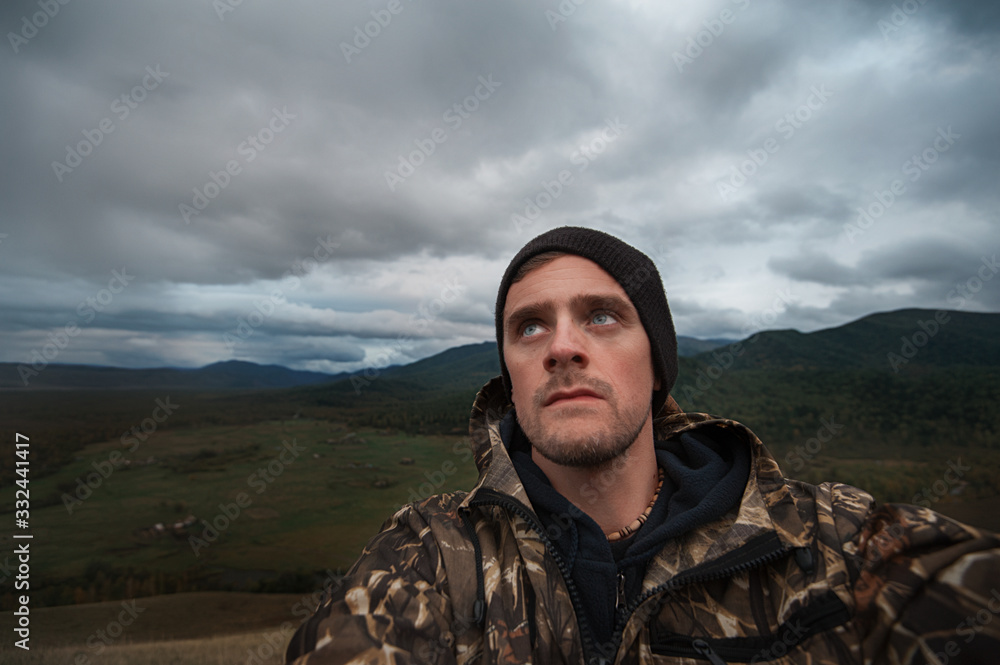 Caucasian man in the mountain making selfie on background nature landscape Caucasian man in the mountain making selfie on background nature landscape