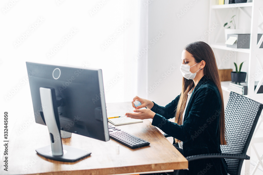 Woman in medical mask at the office Woman in medical mask at the office