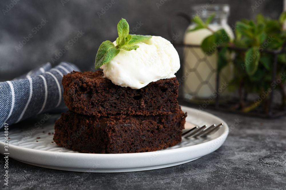 Chocolate brownie with ice cream - a classic American dessert. Chocolate brownie with ice cream - a classic American dessert.