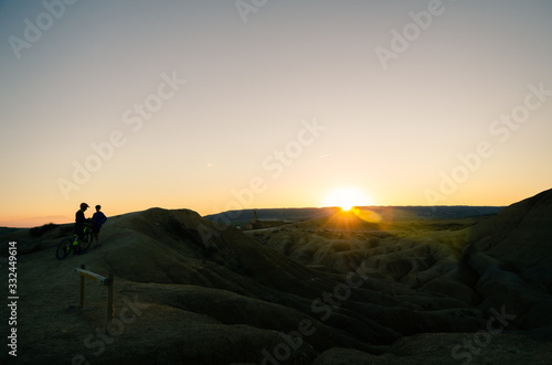 Silhouette of a bicycle in the mountains at sunset