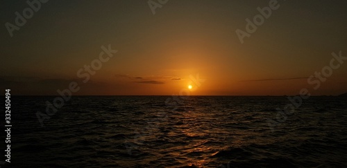 Sunset in the middle of sea