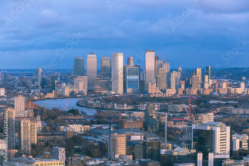 Aerial cityscape of London and the River Thames with Canary Wharf in the background