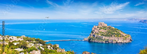 Aerial view of Aragonese Castle, most popular landmark and travel destination located in Tyrrhenian sea near Ischia island, Italy.