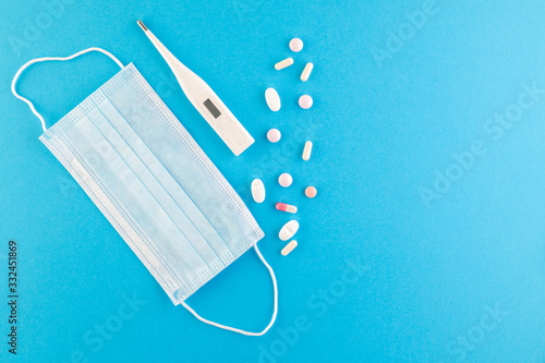 A set of hygienic antiseptics and medications on a blue background.