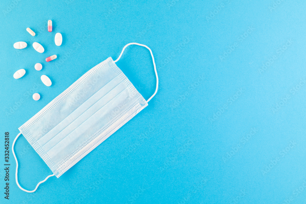 A set of hygienic antiseptics and medications on a blue background. A set of hygienic antiseptics and medications on a blue background.