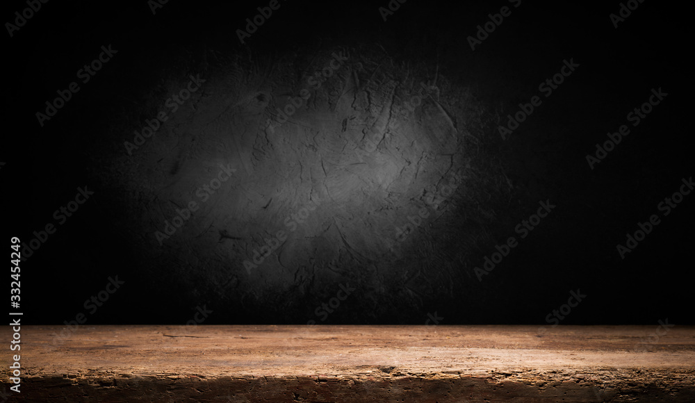 Selected focus empty brown wooden table and wall texture or old black brick wall blur background image. for your photomontage or product display Selected focus empty brown wooden table and wall texture or old black brick wall blur background image. for your photomontage or product display