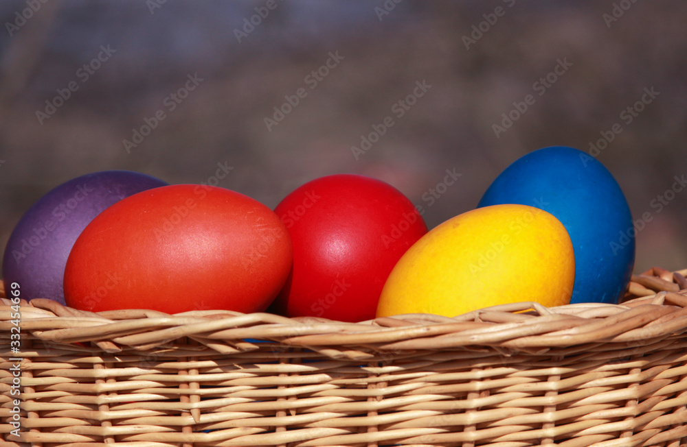 Easter eggs colors in basket blurred background Easter eggs colors in basket blurred background