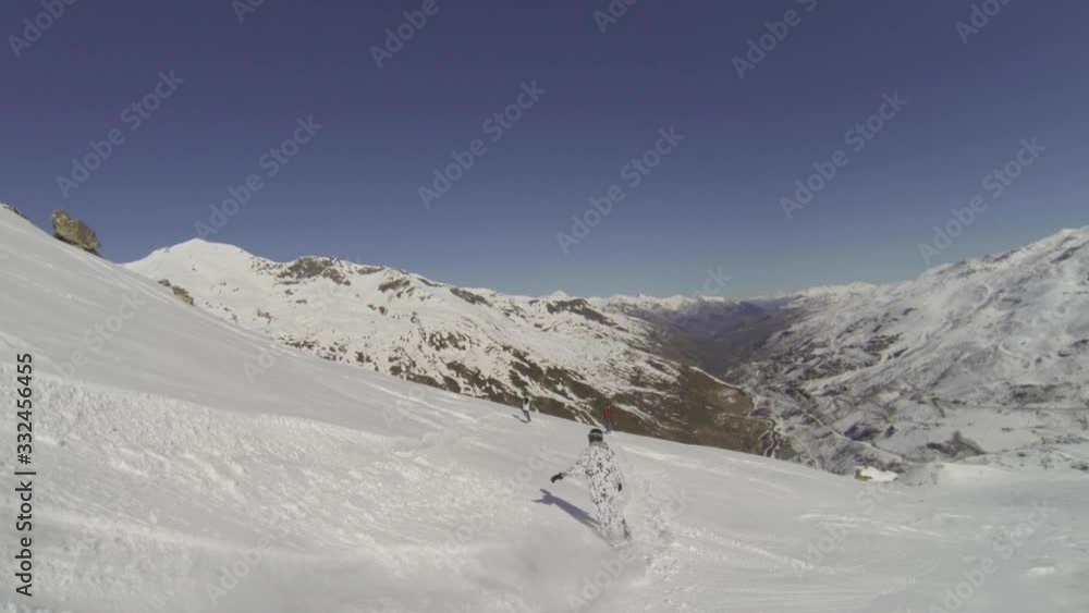 Snowboarder in animal suit snowboarding in powder snow off piste slow motion Snowboarder in animal suit snowboarding in powder snow off piste slow motion