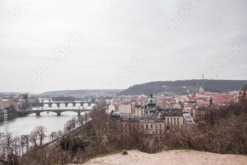 view of the roofs, river and bridges of Prague