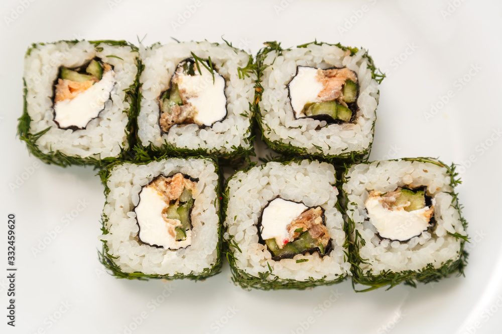 rolls with dill and salmon with soy sauce, ginger and chopsticks. rolls with dill and salmon with soy sauce, ginger and chopsticks.