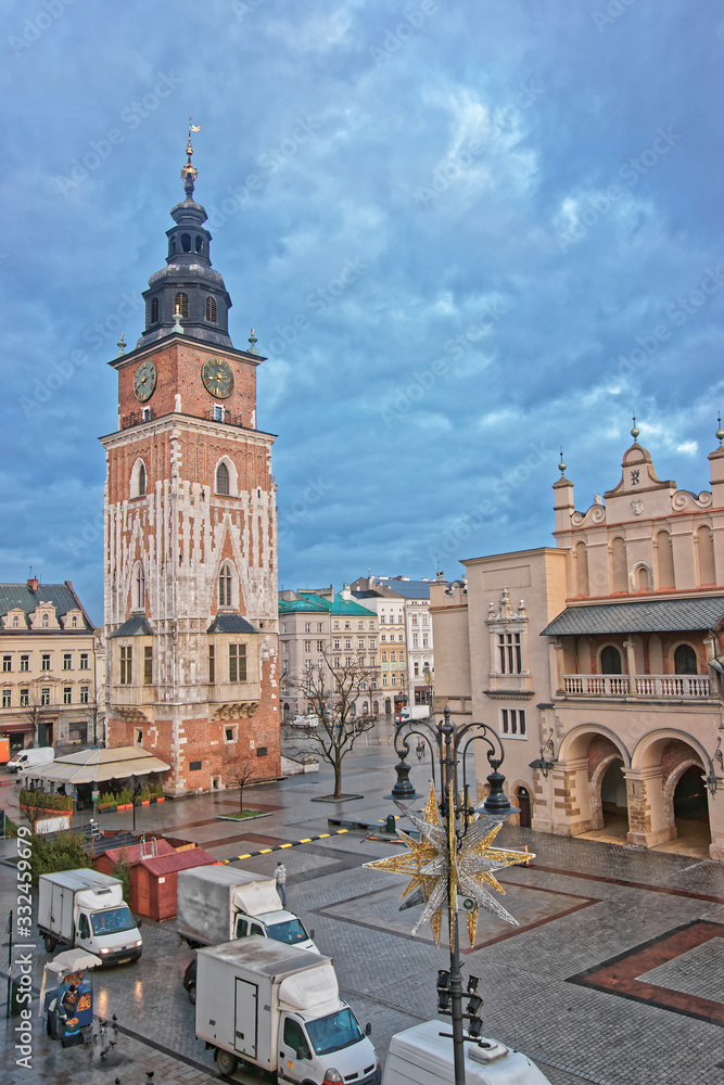 Town Hall Tower and Cloth hall in the Main Market Square of the Old City in Krakow in Poland at Christmas in winter