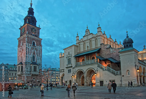 Town Hall Tower and Cloth hall in the Main Market Square of the Old City in Krakow in Poland at Christmas in wintertime