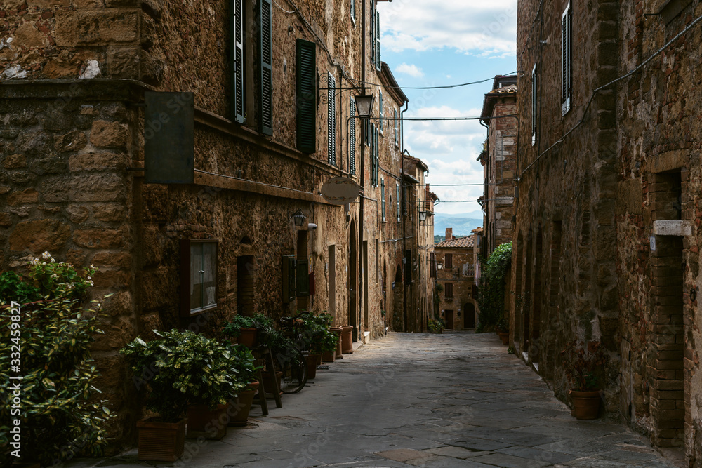 Medieval street in old Italian hill town. Tuscany, Italy