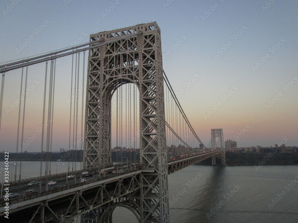 Fototapeta premium Fort Lee, New Jersey: The George Washington Bridge, a double-decked suspension bridge built in 1931, at sunset.