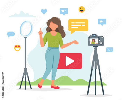 Female video blogger recording video with camera and light. Different social media icons. Cute vector illustration in flat style photo