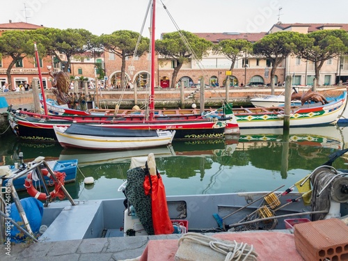 Bay at Caorle, Italy; Sailboats in the historical city photo