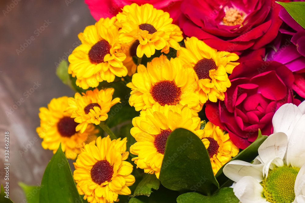 A beautiful bouquet of yellow chrysanthemums and red roses A beautiful bouquet of yellow chrysanthemums and red roses