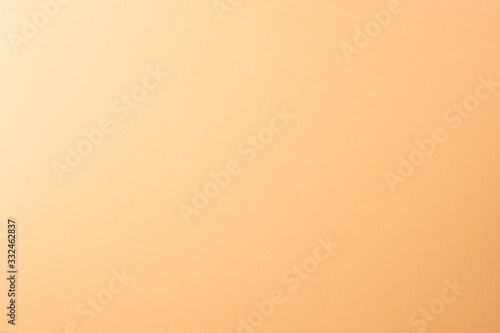 Light orange, peach color paper background, copy space.