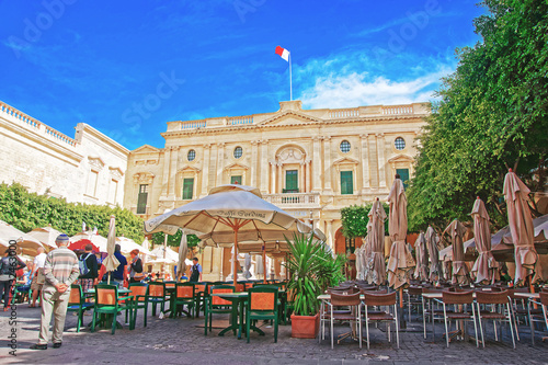 People resting at open air cafes of Republic Square Valletta