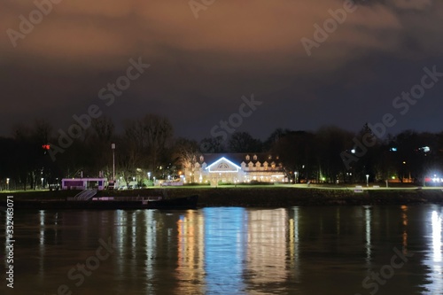 Photography view across the danube to the Au Cafe, lighted, at Night