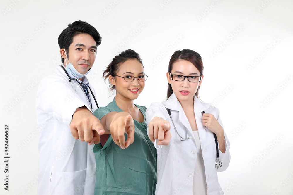 Young asian malay chinese male female doctor on white background pointing finger at camera focus on face Young asian malay chinese male female doctor on white background pointing finger at camera focus on face