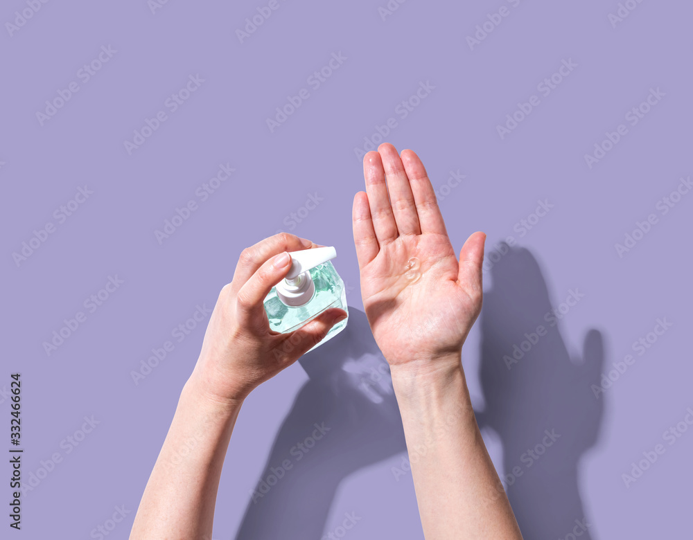 Applying sanitizer gel - healthcare and hygiene concept Applying sanitizer gel - healthcare and hygiene concept