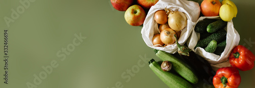 Zero Waste Organic Food In Eco Bag On Green Background. Top View. Reusable Green, Zero Waste,Minimalism, Lifestyle Concept. Place for text