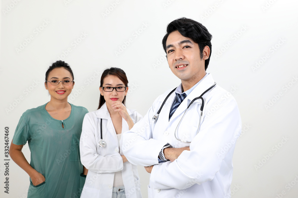 Young asian malay chinese male female doctor on white background posing confident looking at camera Young asian malay chinese male female doctor on white background posing confident looking at camera