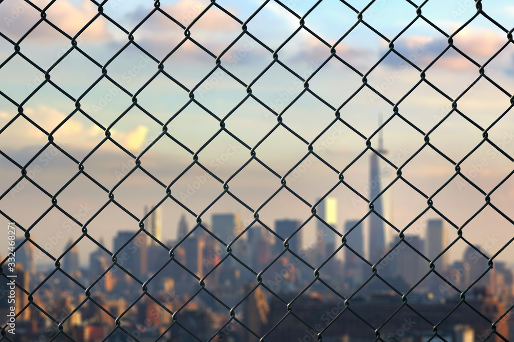 Worldwide coronavirus pandemic. quarantine. New York city behind steel mesh wire fence .Flight ban and closed borders for tourists and travelers in America. Worldwide coronavirus pandemic. quarantine. New York city behind steel mesh wire fence .Flight ban and closed borders for tourists and travelers in America.