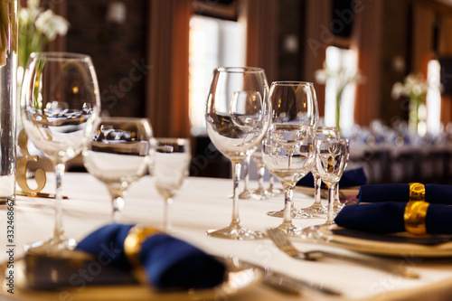Wine glasses and champagne flutes on table, Wedding decor. Selective focus